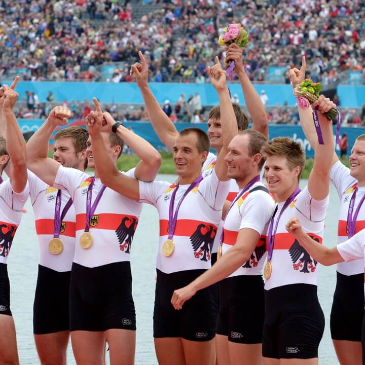 epa03331683 Germany celebrate on the podiium after winning the gold medal in the Men's eight final during the London 2012 Olympic Games Rowing competition at the Eton Dorney rowing centre near the village of Dorney, west of London, Britain, 01 August 2012  EPA/Rainer Jensen